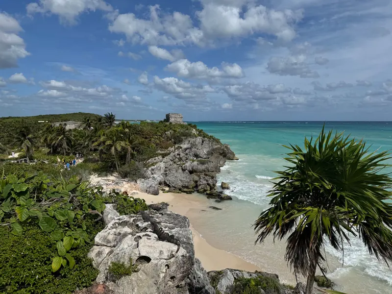 The Tulum ruins on a cliff above a turquoise sea